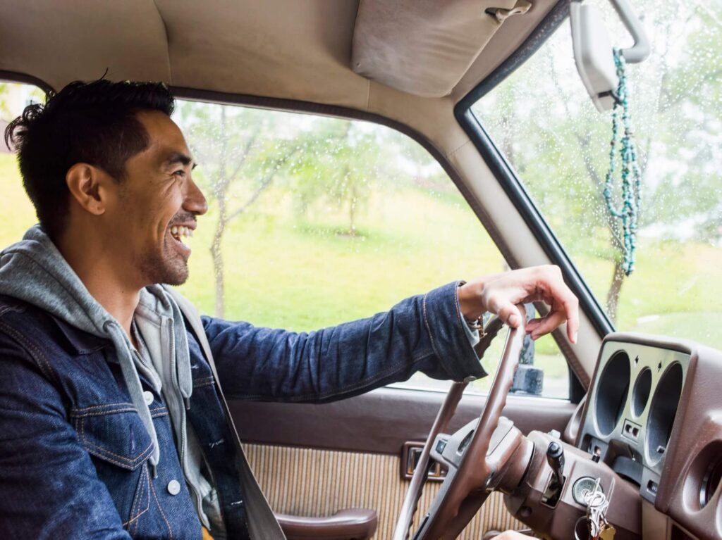 A driver at the wheel of a rental car