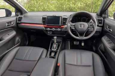 Front cabin of the Honda City, showing the dashboard, steering wheel and front seats
