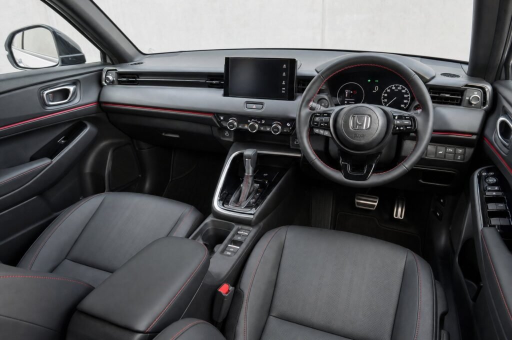 Front cabin of the Honda HR-V, showing the dashboard, steering wheel and front seats