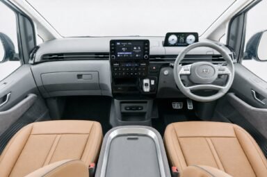 Front cabin of the Hyundai Staria, showing the dashboard, steering wheel and front seats