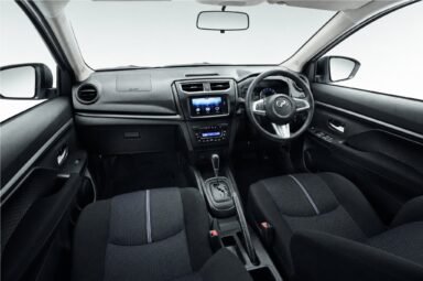 Front cabin of the Perodua Aruz, showing the dashboard, steering wheel and front seats