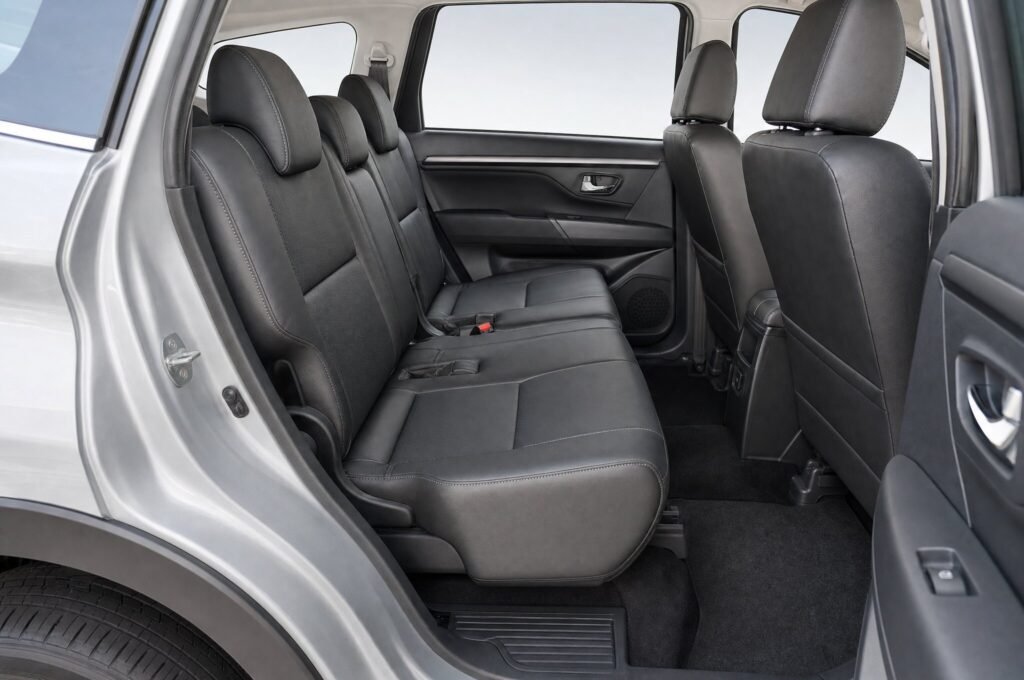 Rear passenger seats of the Perodua Aruz, showing the legroom and upholstery