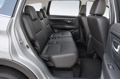 Rear passenger seats of the Perodua Aruz, showing the legroom and upholstery