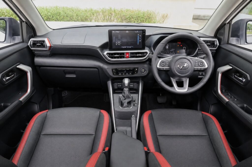 Front cabin of the Perodua Ativa, showing the dashboard, steering wheel and front seats