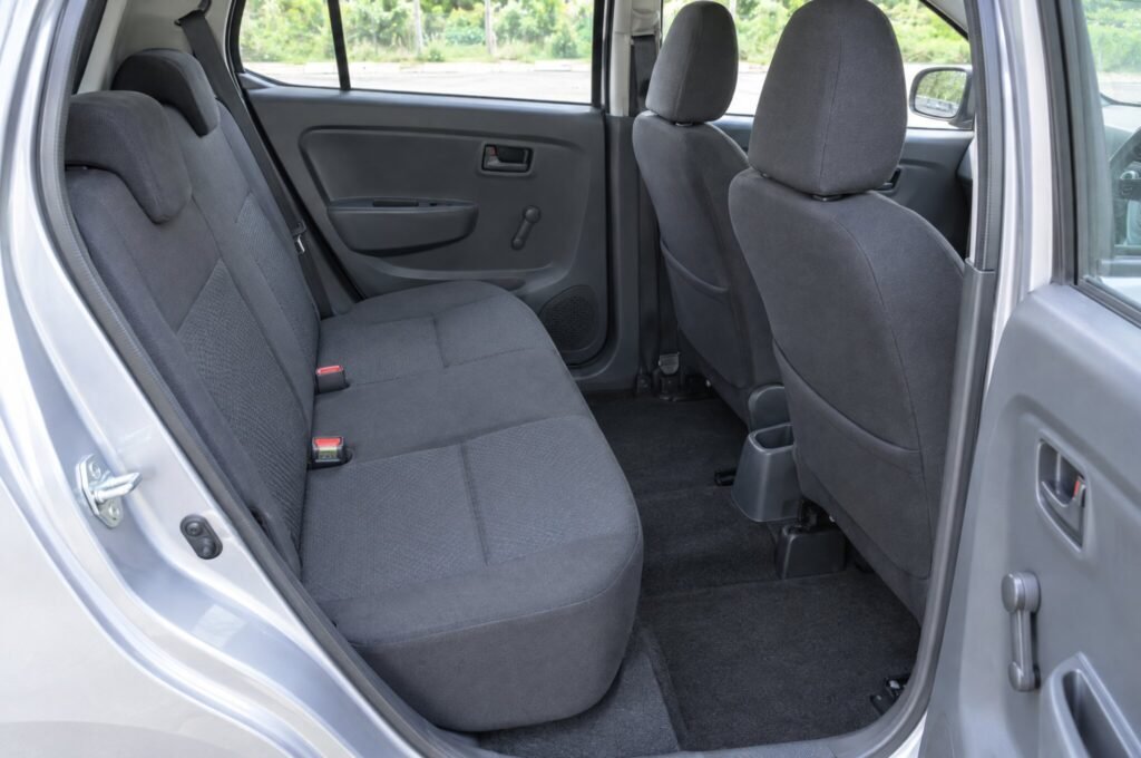 Rear passenger seats of the Perodua Axia, showing the legroom and upholstery