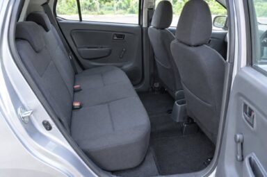 Rear passenger seats of the Perodua Axia, showing the legroom and upholstery