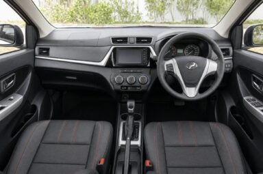 Front cabin of the Perodua Bezza, showing the dashboard, steering wheel and front seats