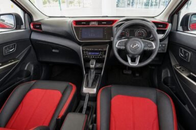 Front cabin of the Perodua Myvi, showing the dashboard, steering wheel and front seats