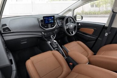 Front cabin of the Proton Persona, showing the dashboard, steering wheel and front seats