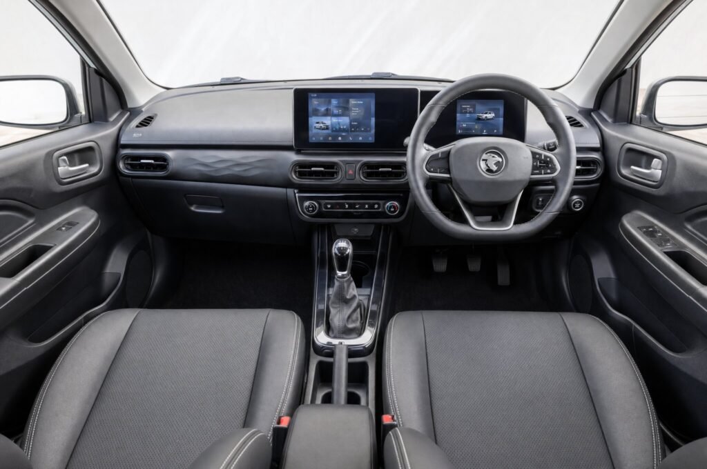 Front cabin of the Proton Saga, showing the dashboard, steering wheel and front seats