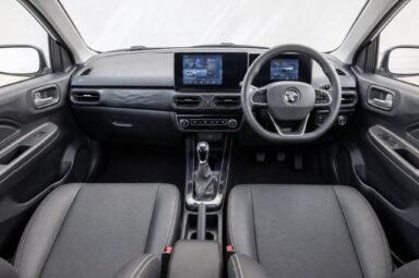 Front cabin of the Proton Saga, showing the dashboard, steering wheel and front seats
