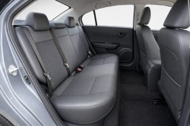 Rear passenger seats of the Proton Saga, showing the legroom and upholstery