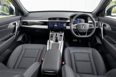Front cabin of the Proton X70, showing the dashboard, steering wheel and front seats