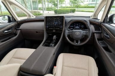 Front cabin of the Toyota Alphard (AGH40), showing the dashboard, steering wheel and front seats