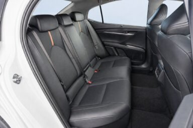 Rear passenger seats of the Toyota Camry, showing the legroom and upholstery