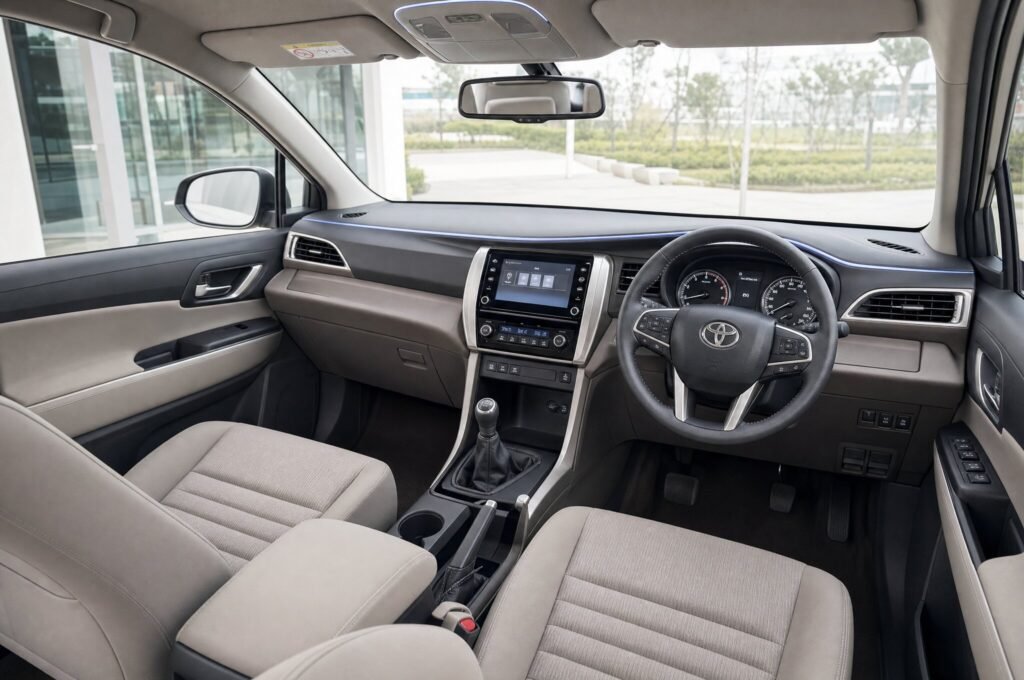 Front cabin of the Toyota Innova, showing the dashboard, steering wheel and front seats