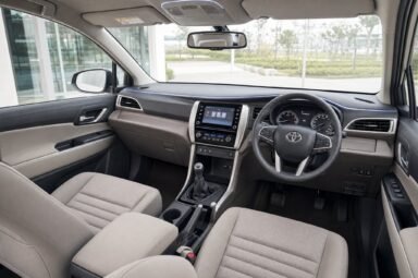 Front cabin of the Toyota Innova, showing the dashboard, steering wheel and front seats